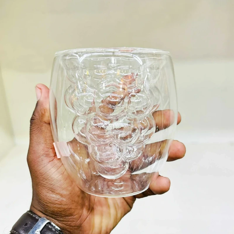 Double layered grape-shaped glass cups for coffee drinks.