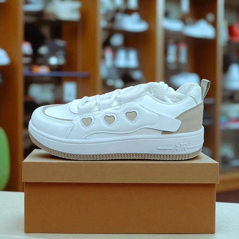 212 - White Sneakers with Heart-Shaped Cutouts and Trendy Design—Perfect for a Chic Look