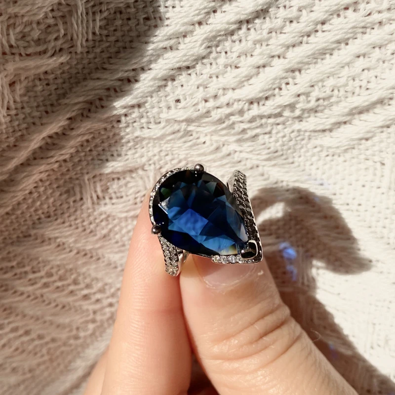 Pear Cut Blue Topaz Ring with Diamond Accents