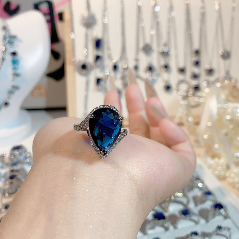 Pear Cut Blue Topaz Ring with Diamond Accents