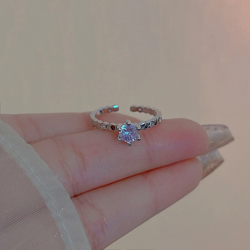 Pretty adjustable solitaire ring with accent stones