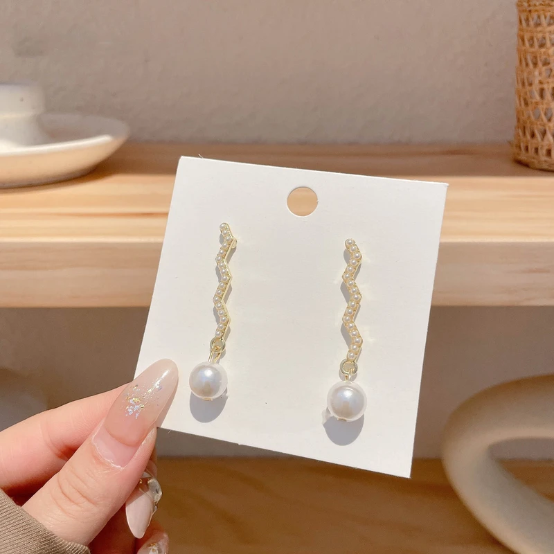 Sophisticated white color earrings