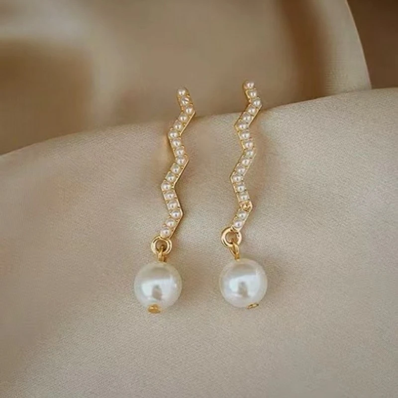Sophisticated white color earrings