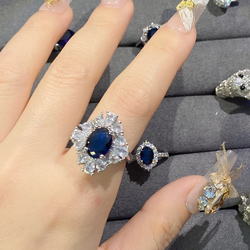 Exquisite cluster design blue sapphire ring