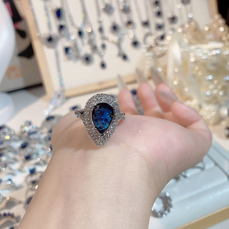 Pear-shaped Blue Sapphire Halo Ring.