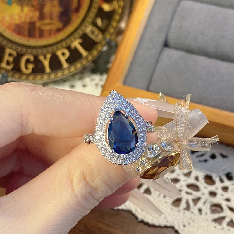 Pear-shaped Blue Sapphire Halo Ring.