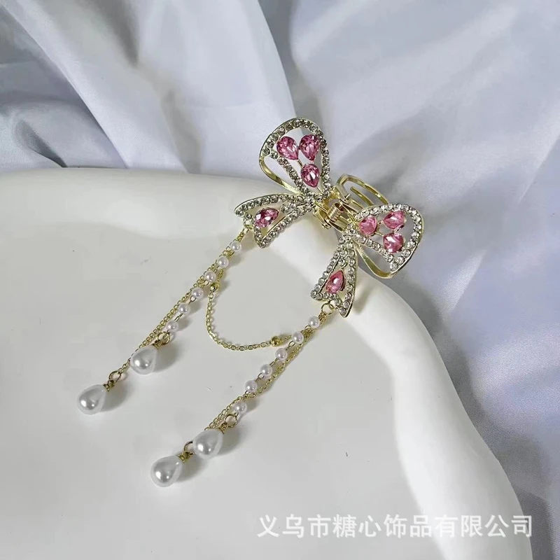 Beautiful pink color tassel claw clip