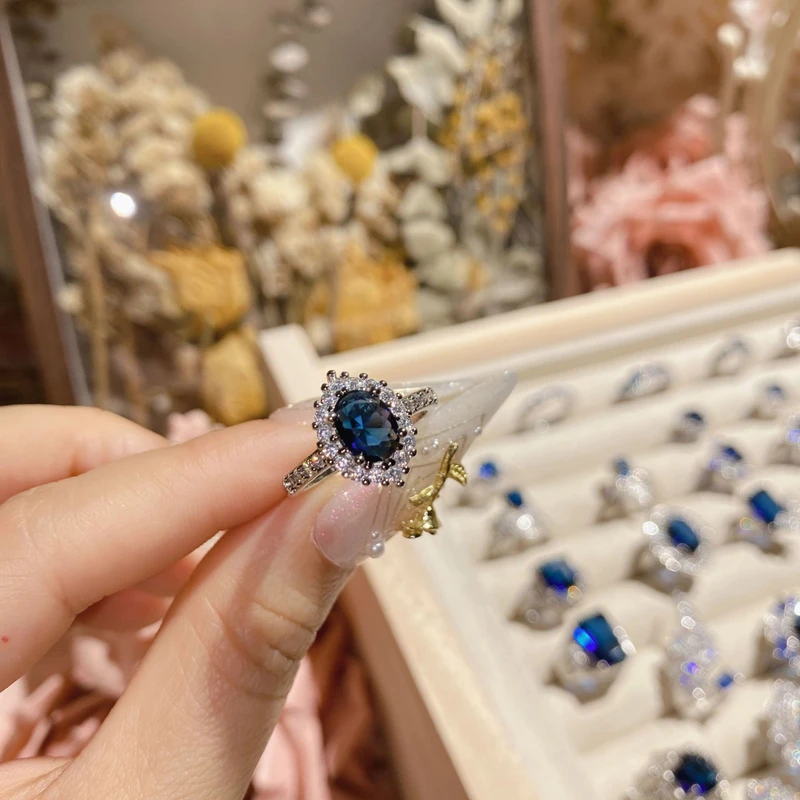 Halo sapphire blue ring
