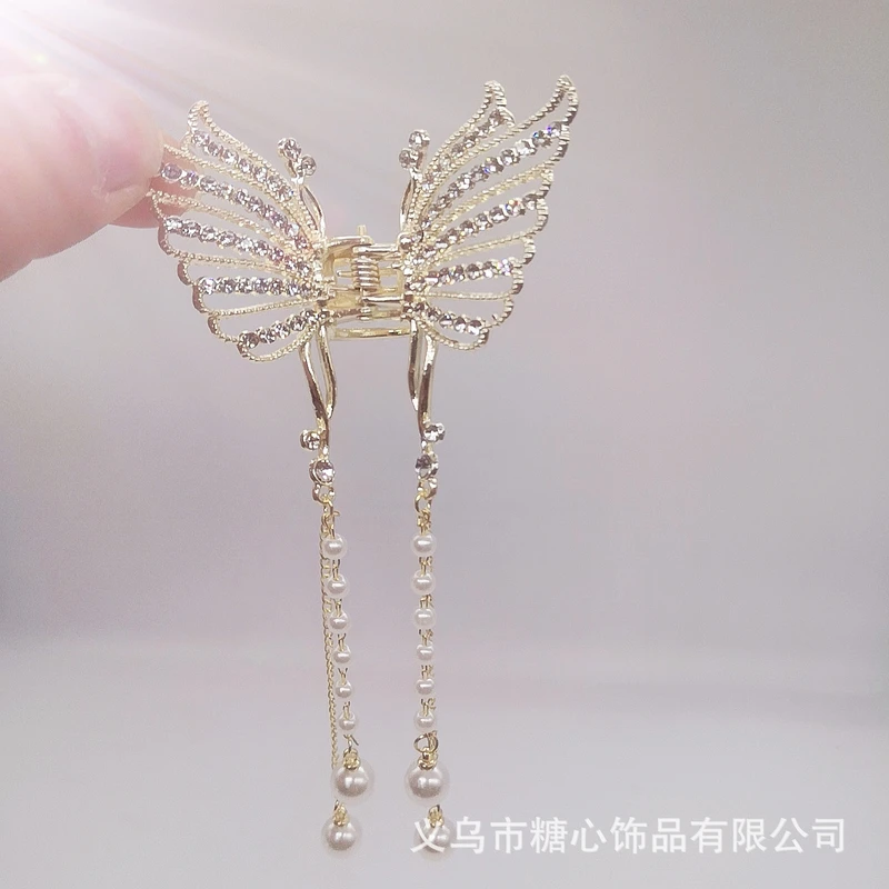 Gorgeous golden color butterfly tassel claw clip